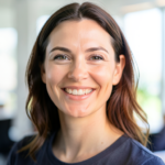 A friendly Caucasian woman is smiling at the camera, representing satisfied clients.